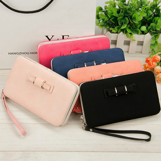 Factory spot low price wholesale new version of women's wallet in the long money bag butterfly knot lunch box woman bag tide